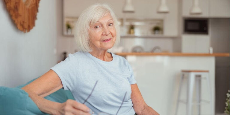 Happy Elderly Woman Relaxing at Assisted Living Facility