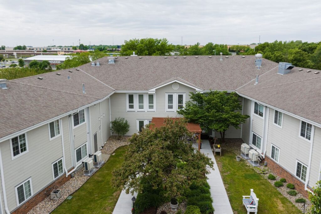 Peaceful Inner Courtyard With Pergola And Mature Trees At Assisted Living Facility