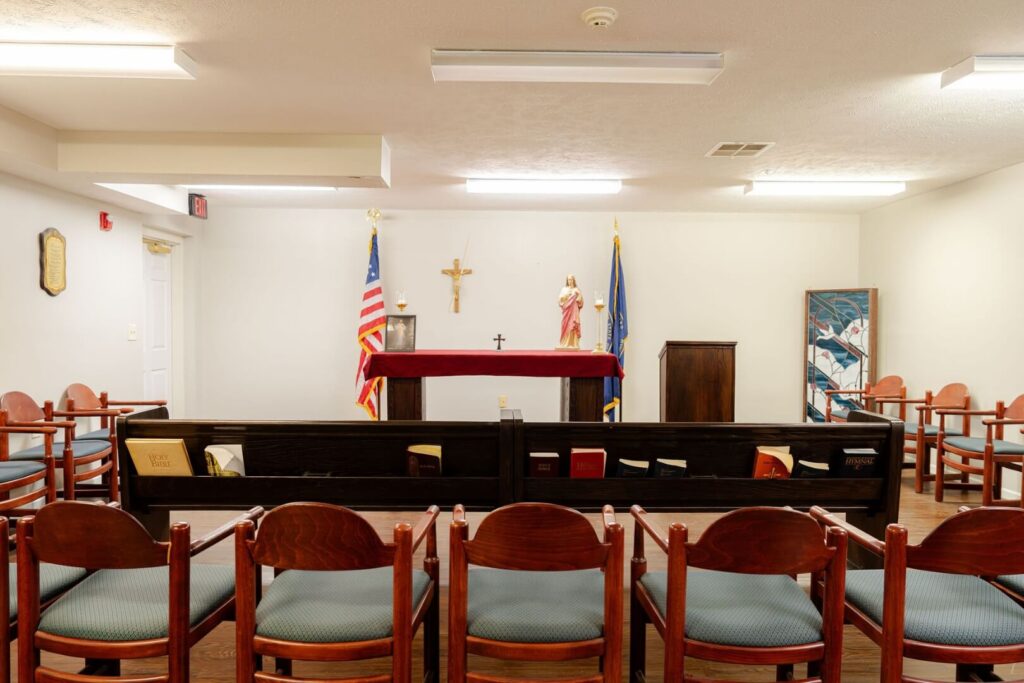 Intimate Chapel With Wooden Pews And Altar At Assisted Living Facility