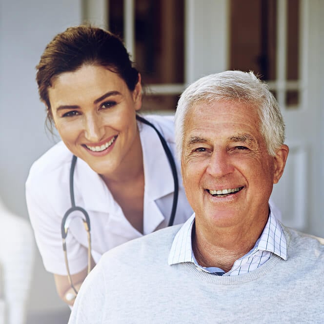 Caregiver Comforting Resident at Memory Care Facility